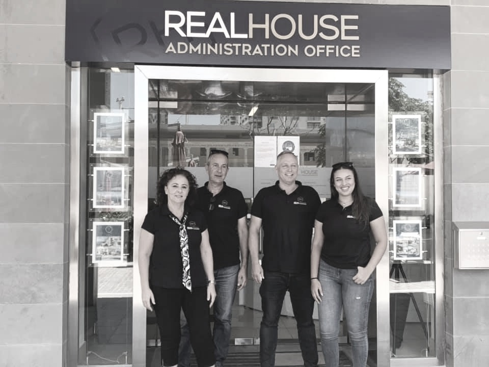 The Realhouse team outside the Administration Office at Tigné Point, Sliema